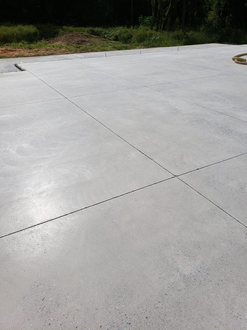 Large broom-finish concrete slab with straight saw-cut control joints